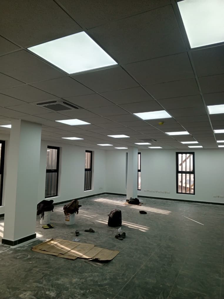 Completed bright commercial interior with white painted walls and columns