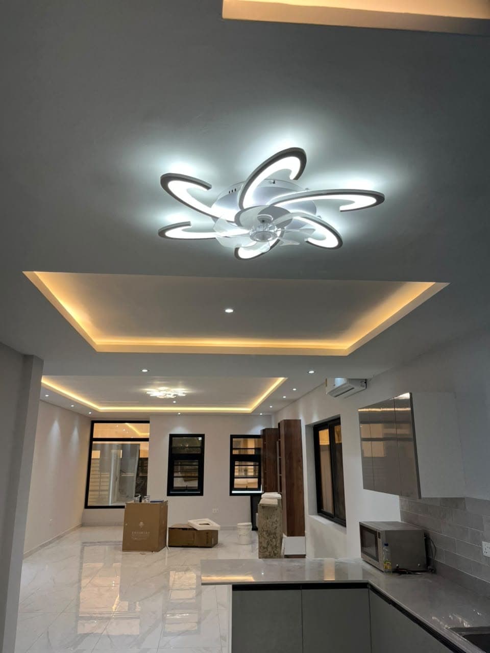 Completed modern interior with painted recessed ceilings and feature lighting