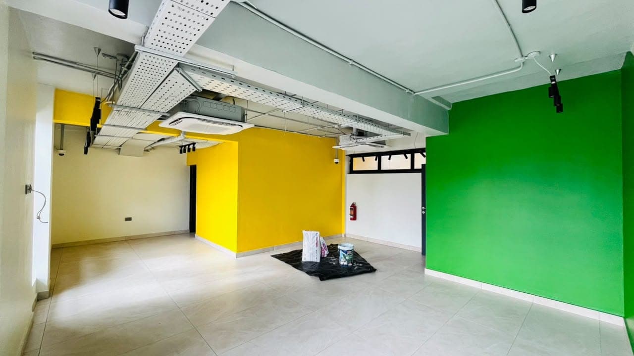 Commercial interior with bright green and yellow painted feature walls